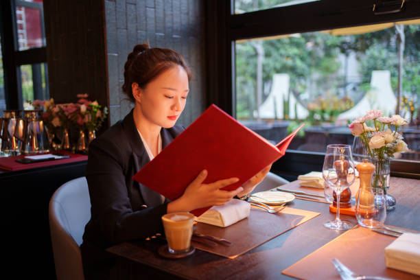 istock business woman looking at menu 2149480008