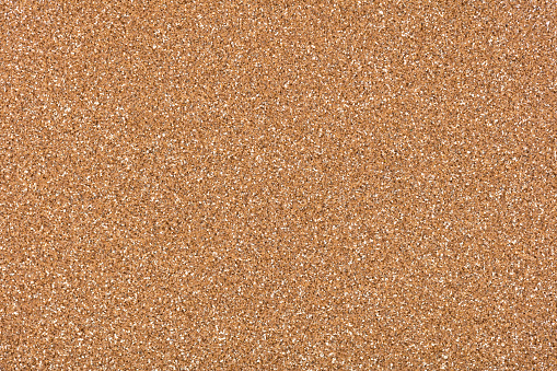 Glitter background, your new shiny texture in admirable golden tone. High resolution photo.