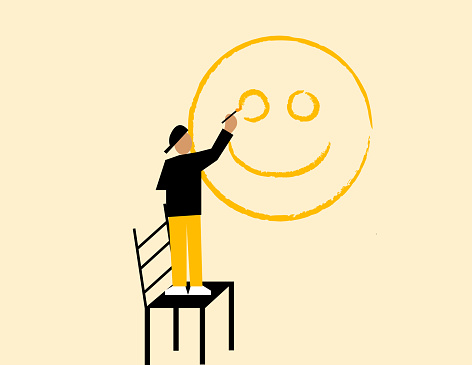 A man painting happy face