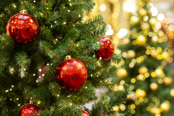 istock Holiday celebration, Christmas tree with bright lights, festive ornaments, December 2149485817