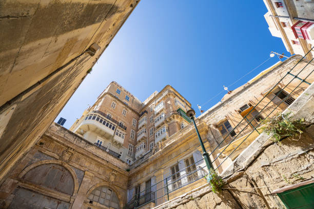 Valletta, Malta, April 03, 2024.  Bottom view of the characteristic old buildings in the city center