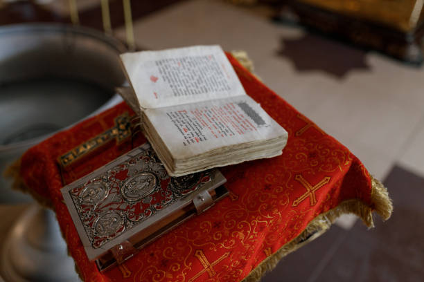 istock Open prayer book in church on the table 2149487857