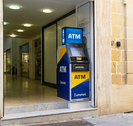 Valletta, Malta, April 03, 2024.  An ATM machine in a treet in the city center