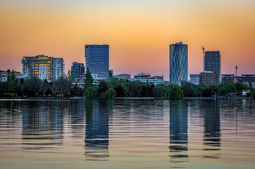 Bucharest skyline and the Herastrau lake park at dusk. Photo taken on 5th of April 2024 in Bucharest, Romania.