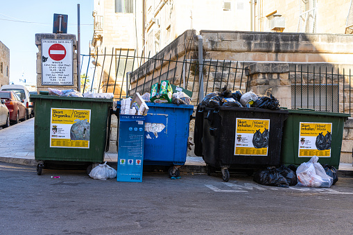 Valletta, Malta, April 03, 2024. the bins full of separate waste collection in the historic center of the city
