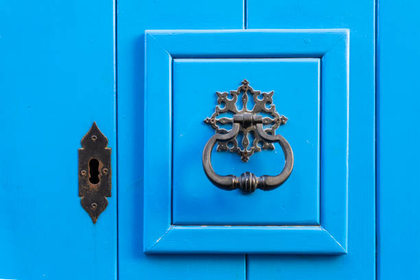 Valletta, Malta, April 03, 2024.  detail of an old door knocker on a door in the city centre