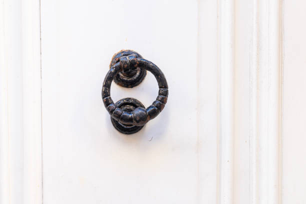 Valletta, Malta, April 03, 2024.  detail of an old door knocker on a door in the city centre