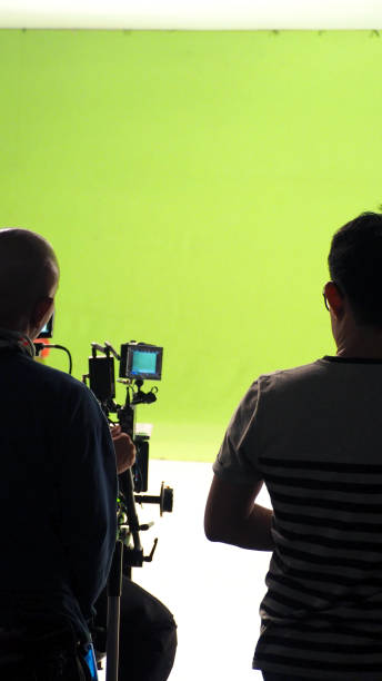 istock Behind the vdo camera in studio production that shooting or filming green screen background for chroma key technique in post process with professional crew teams and equipments. 2149489091