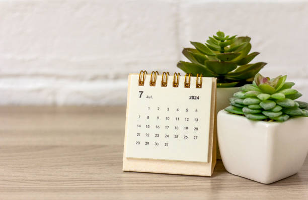 istock Desk calendar for July 2024 on the table with copy space. 2149489763