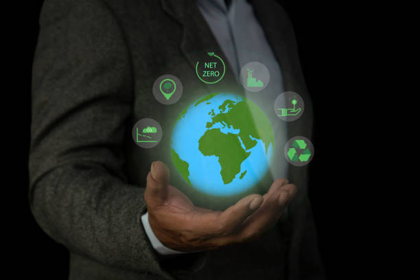 istock Business man holding green earth and Net Zero icon for net zero emissions target. Environment Social and Governance, Carbon neutral concept net zero 2149489939