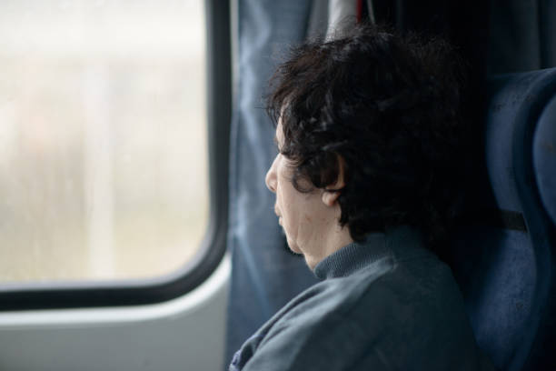 istock Serene Senior Woman Reflecting by Train Window 2149490323