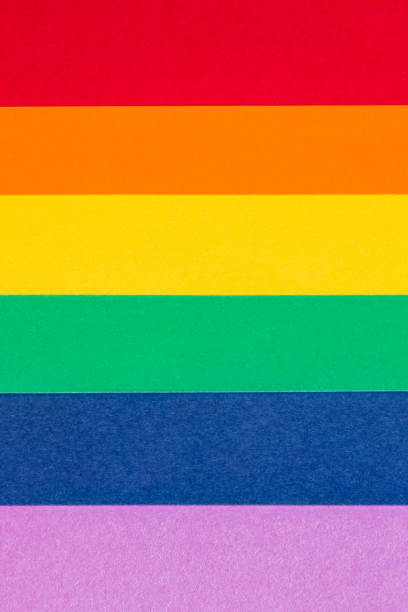 istock A vertical image showcasing a handmade representation of DIY gay pride flag, composed of brightly colored paper sheets layered to create the iconic rainbow spectrum 2149491072