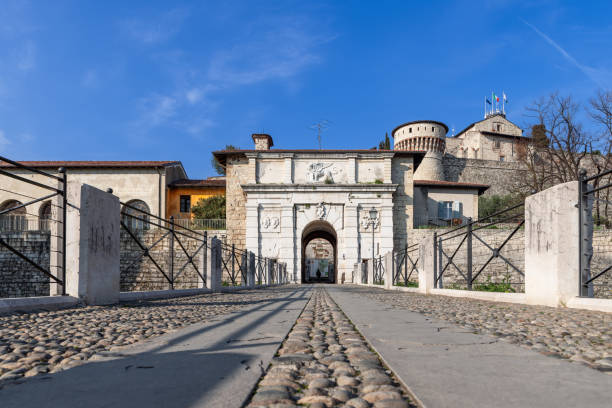 istock The perspective from ground level leads through a cobbled pathway to Brescia castle entrance, where a lion relief proudly marks the historical gateway 2149491180