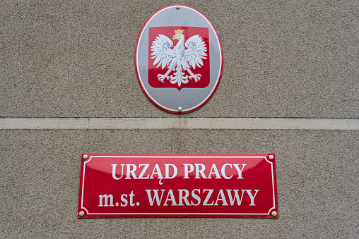 Metal plaque with the inscription Employment Office of the Capital City of Warsaw