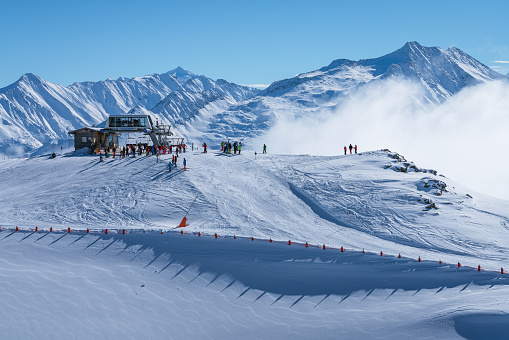 Lots of people skiing on a track on the Hochzillertal mountain, Tyrol, Austria