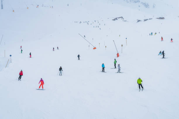 Lots of people skiing on a track on the Hochzillertal mountain, Tyrol, Austria