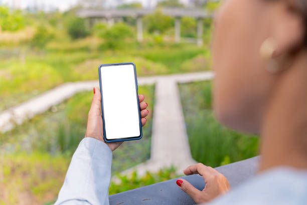 istock Focusing on Latin American woman's hand using smartphone and texting messages to her friend during taking a rest on weekend at home. Social media. Digital engagement 2149494457