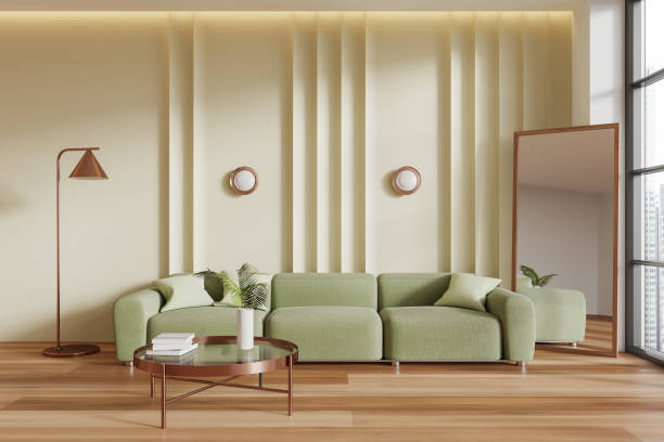 istock Green living room interior with couch and coffee table, mirror and window 2149495151
