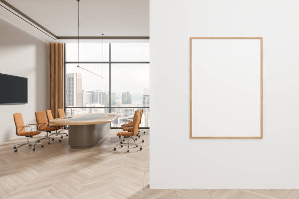 istock Cozy office interior with meeting table and tv screen, window and mockup frame 2149496176