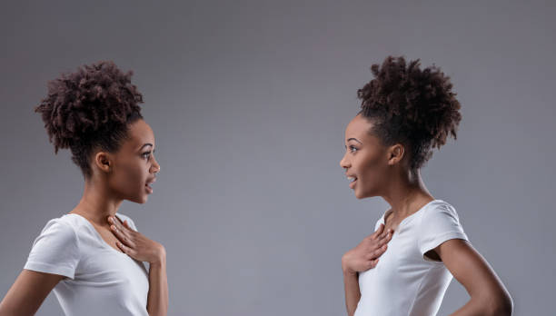 istock Both women astonished by their mirrored similarities: me too! 2149496178