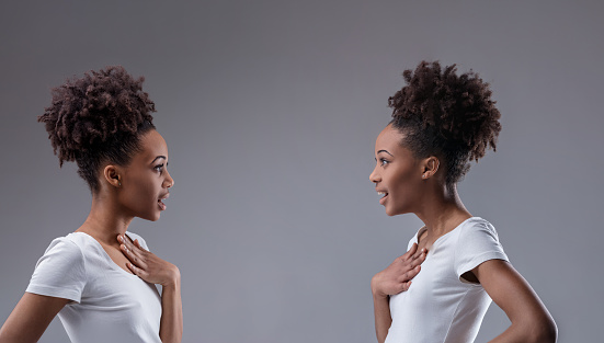 Surprising discovery of common ground shown in the mirrored expressions of two black women