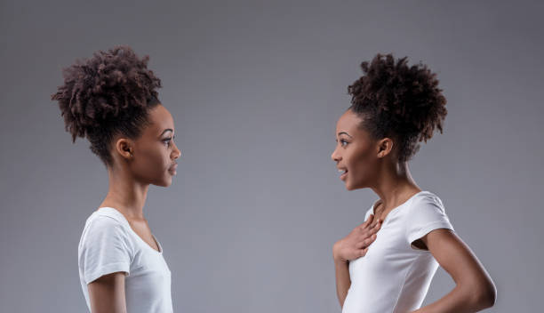 istock Judgemental stance against self's reflection of surprise. Who? M 2149496217
