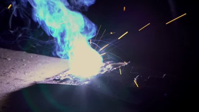 Welding Sparkles Creating Glowing Flame And Bright Particles Floating In The Air