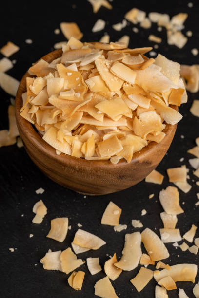 istock sweet orange and yellow coconut flakes fried in sugar 2149496729