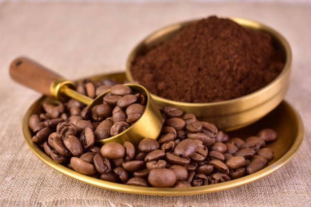 istock Ground coffee and coffee beans in a copper bowl. Close-up. 2149497124