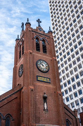Clock tower of Old St. Mary's cathedral downtown San Francisco during springtime day