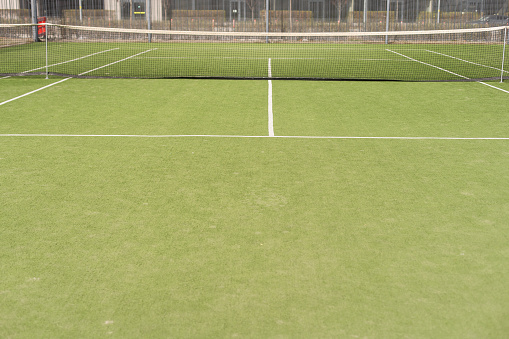 a closeup indoor tennis court lines playing green boundary line courts sports activity