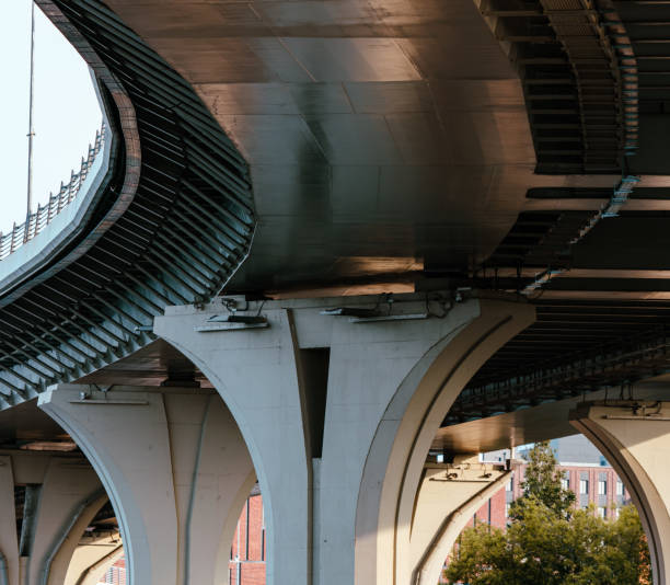 istock Concrete pillars of a large bridge. Bottom view 2149502822