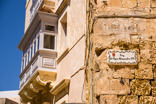 Street sign on decorated tile in Città Vittoriosa in Malta