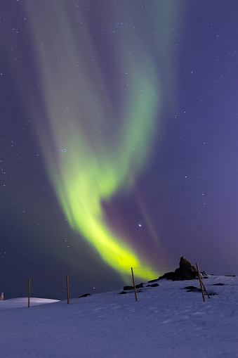 Aurora borealis with clear sky and stars.