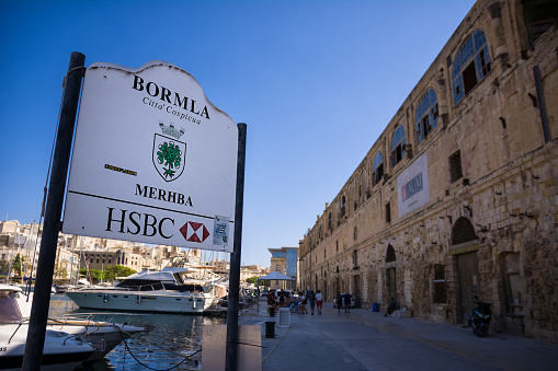 Cospicua, Malta - 17 June 2023: Cospicua port pier with road sign