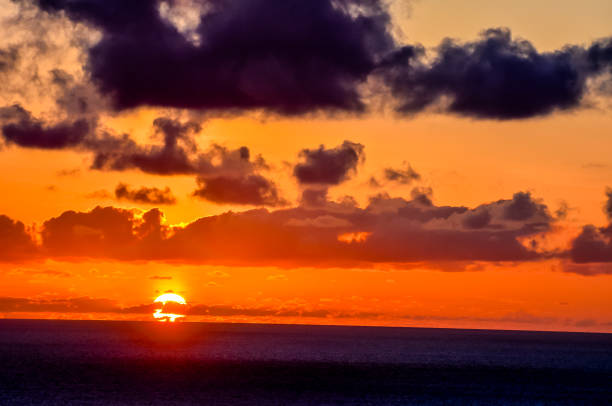 istock The sky is filled with clouds and the sun is setting 2149508009