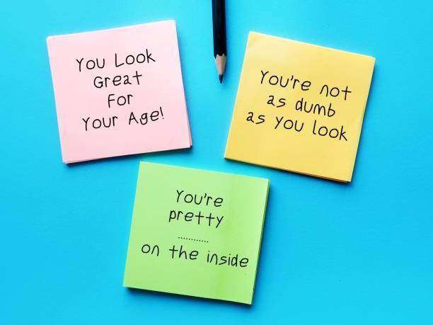 istock Note paper with sample of Backhanded Compliments - remark which seems to be an insult than compliment, seems positive but has a negative undertone 2149509376