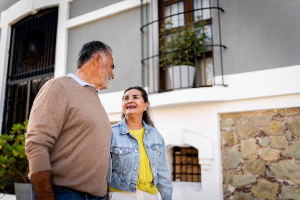 istock Senior couple talking and walking through the city 2149509657