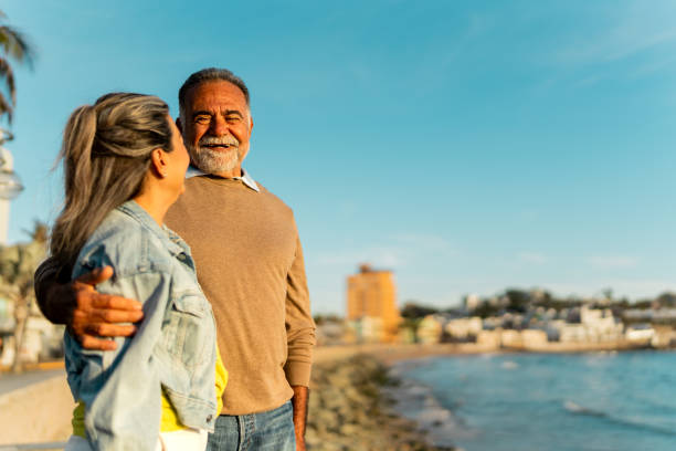 istock Senior couple talking on coastline beach 2149509891
