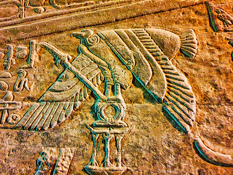 Stylized bas relief of vulture goddess Nekhbet on the walls in the Temple of Hathor at Dendera completed in the Ptolemaic era around 50 BC between Luxor and Abydos towns,Egypt