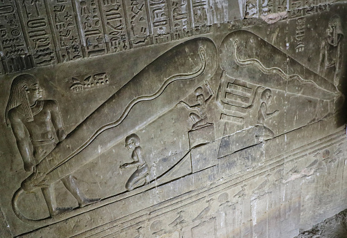 The Dendera lightbulb in the crypt depicting the egyptian creation myth of the snake,Harsomtus,emerging from a lotus,supported by djed pillar in the Temple of Hathor at Dendera near Abydos town,Egypt