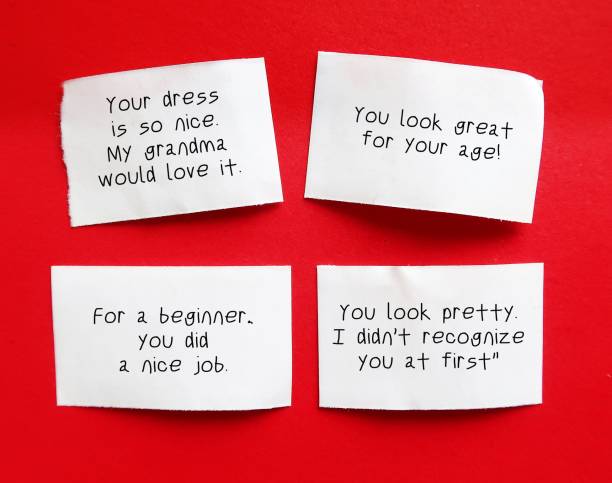 istock Note paper with sample of Backhanded Compliments - remark which seems to be an insult than compliment, seems positive but has a negative undertone 2149514469