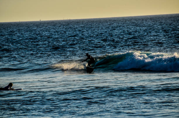 istock A surfer is riding a wave in the ocean 2149517308