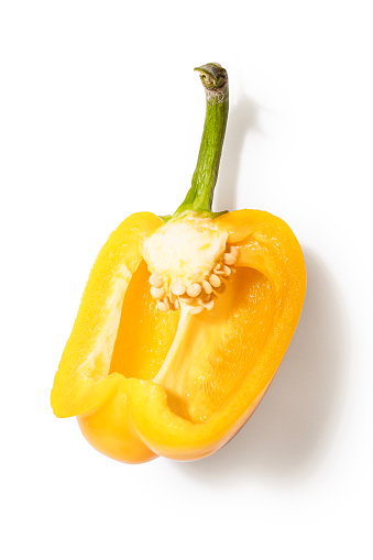 Cross section of yellow pepper hanging on a jute string, 
pepper seed nest. Yellow pepper has a very beneficial effect on our eyesight. It contains a lot of lutein and zeaxanthin, which are important for the proper functioning of eyesight. Both of these compounds can neutralize free radicals in the retina. Yellow peppers are also a good s