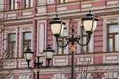 Lamppost in front of a historical building.