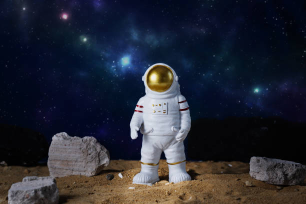 istock Figurine of astronaut over blue star sky background, copy space. 2149521196