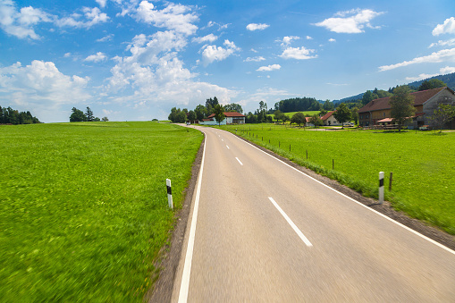 View at Asphalt road in Germany, Bavaria in a beautiful summer day
