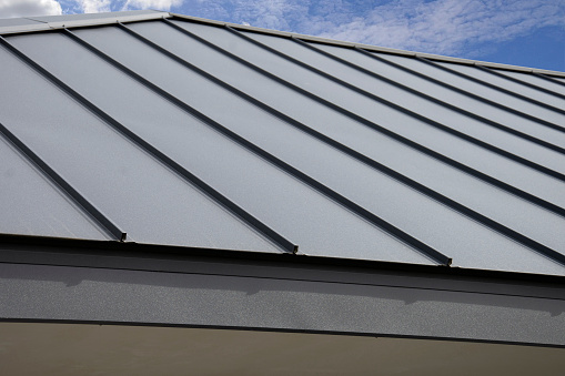 Gray Seam Metal Roof on sky background