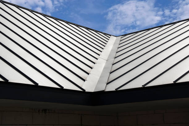istock Standig seam metal roofing system on sky background 2149522233