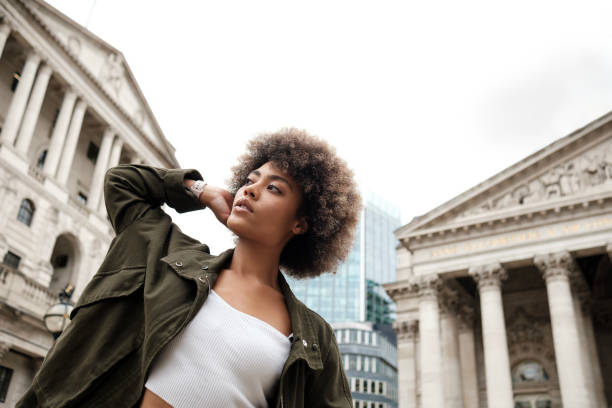 istock Curly mixed race female model posing in front of historical building. 2149525793